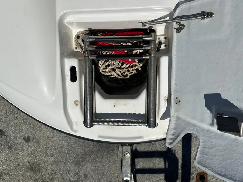 Slide: The Image of Yamaha SX210 2011 boat ladder and storage compartment with rope. - 13