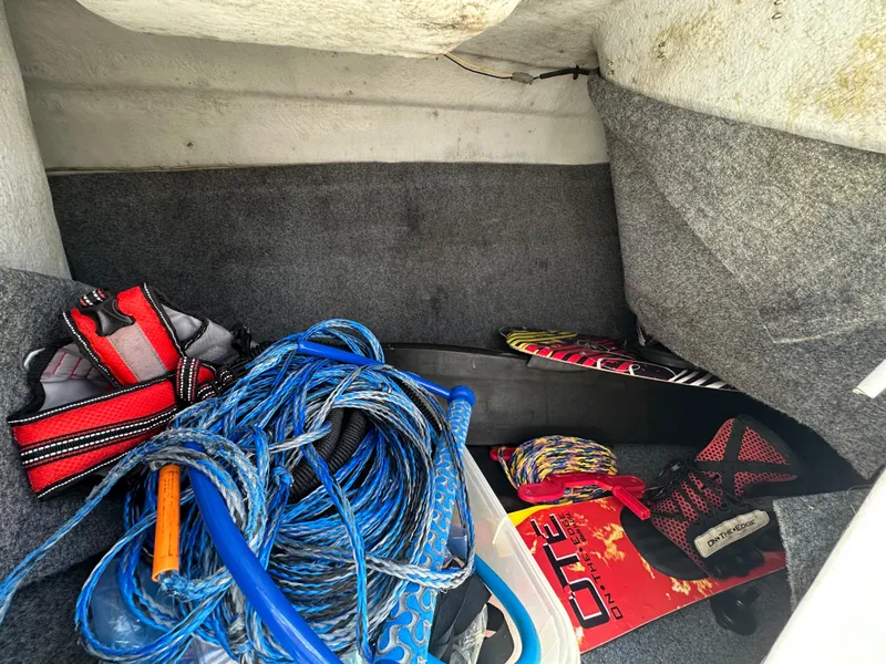 Slide: The Image of Storage compartment of a 2011 Yamaha SX210 boat with water sports gear. - 24