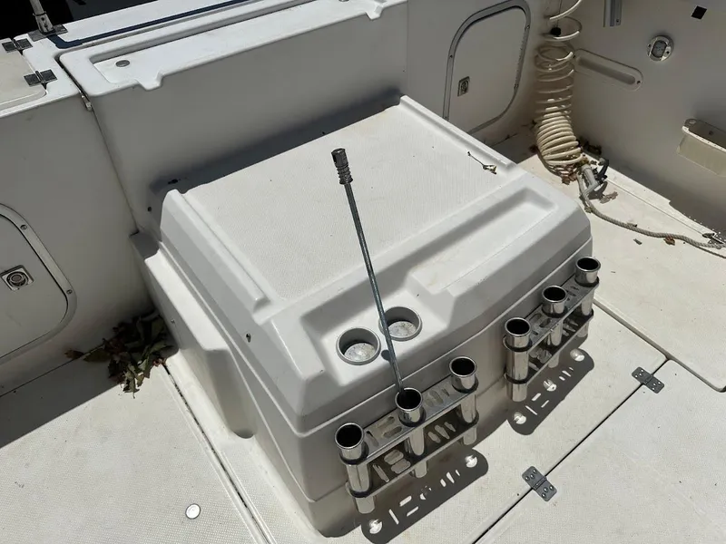 Slide: The Image of 1992 Bayliner 2359 Trophy boat deck with rod holders and storage compartments. - 17