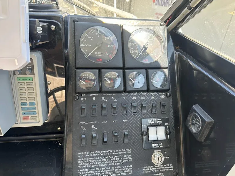 Slide: The Image of Dashboard of a 1992 Bayliner 2359 Trophy boat with gauges and controls. - 30
