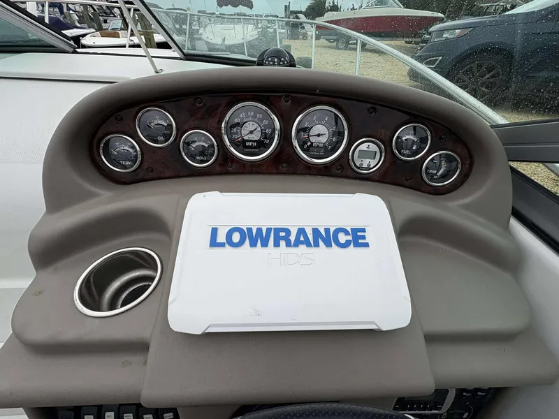 Slide: The Image of Dashboard of 2018 Crownline 264 CR boat with Lowrance HDS system and gauges. - 12