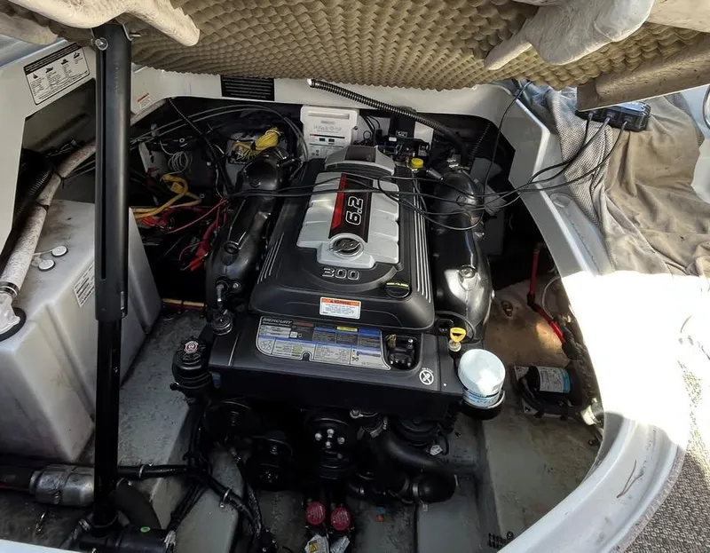 Slide: The Image of Engine compartment of a 2018 Crownline 264 CR boat, featuring a 6.2L engine. - 28