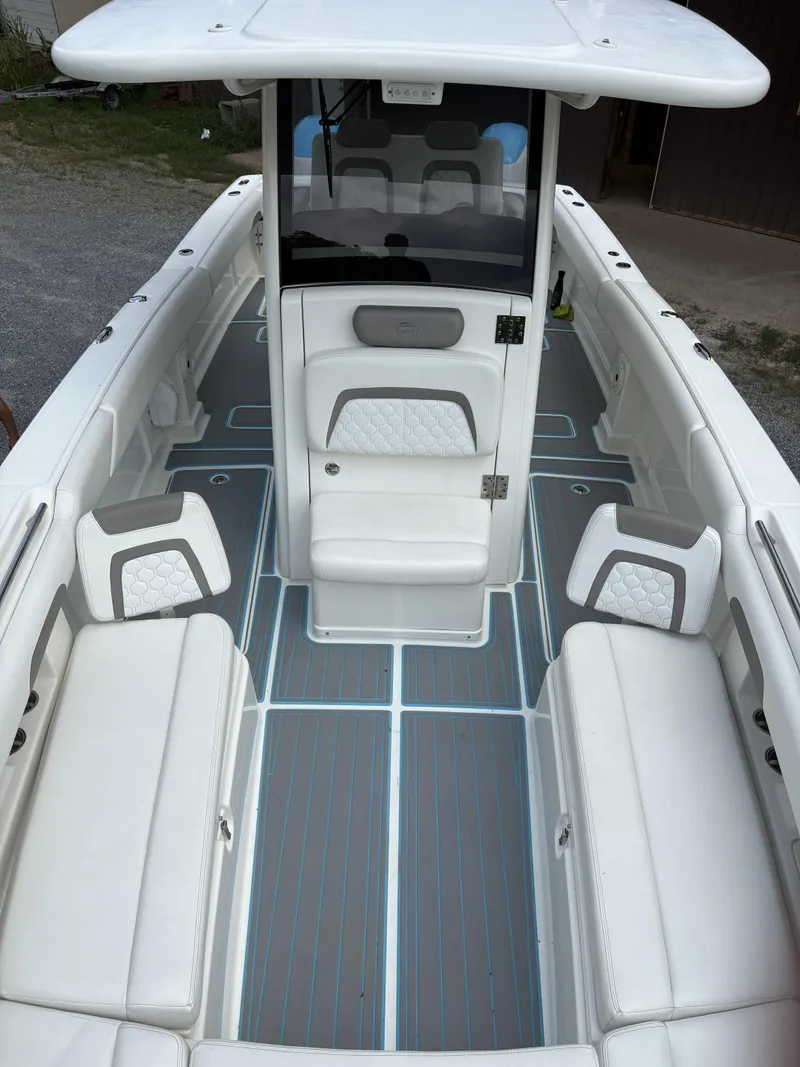 Slide: The Image of 2020 World Cat 280 CC-X boat interior with white seating and modern design. - 10