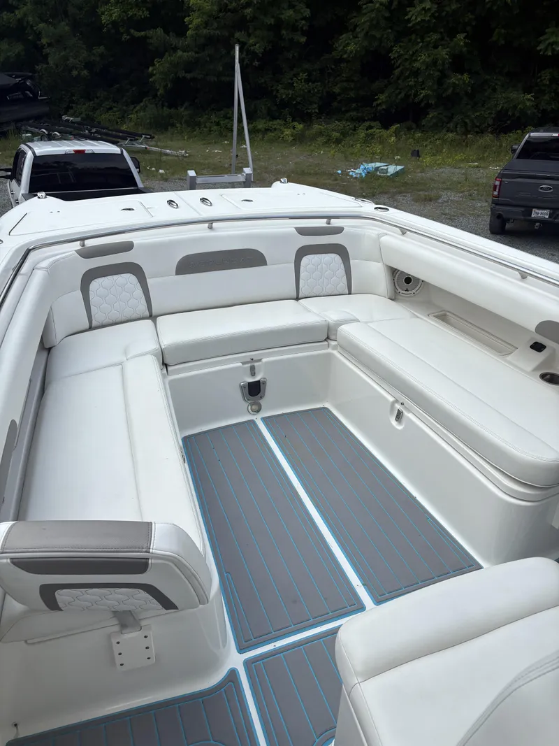Slide: The Image of 2020 World Cat 280 CC-X boat interior with white seating and gray flooring. - 15
