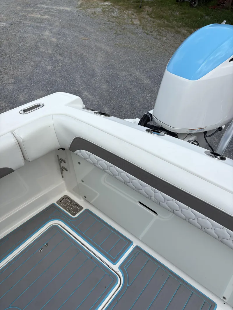Slide: The Image of 2020 World Cat 280 CC-X boat interior with sleek seating and modern flooring. - 16