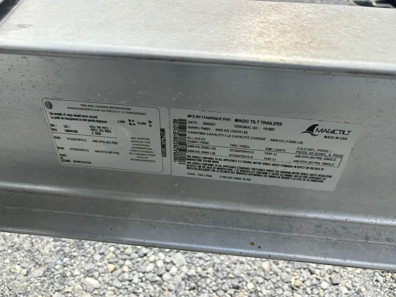 Slide: The Image of Label on Magic Tilt trailer showing tire and loading information. - 21