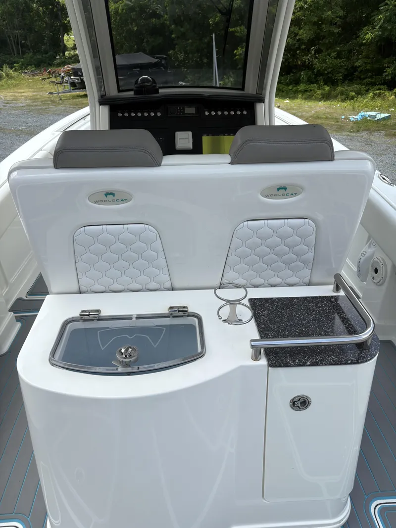 Slide: The Image of 2020 World Cat 280 CC-X boat interior with seating and console, featuring modern design elements. - 9