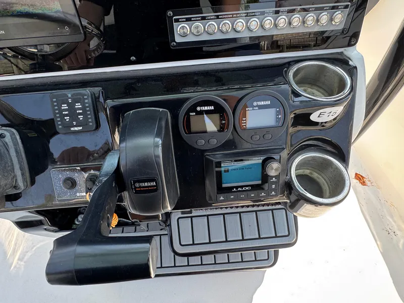 Slide: The Image of Control panel of a 2022 Tidewater 220 LXF boat with Yamaha gauges and JL Audio system. - 17