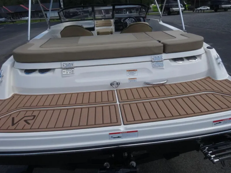 Slide: The Image of 2022 Bayliner VR4 boat with tan seating and teak-style swim platform. - 8