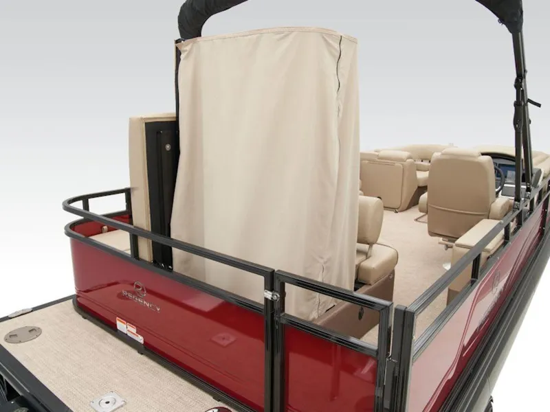 Slide: The Image of 2024 Regency 250 DL3 pontoon boat with privacy enclosure and beige seating. - 11