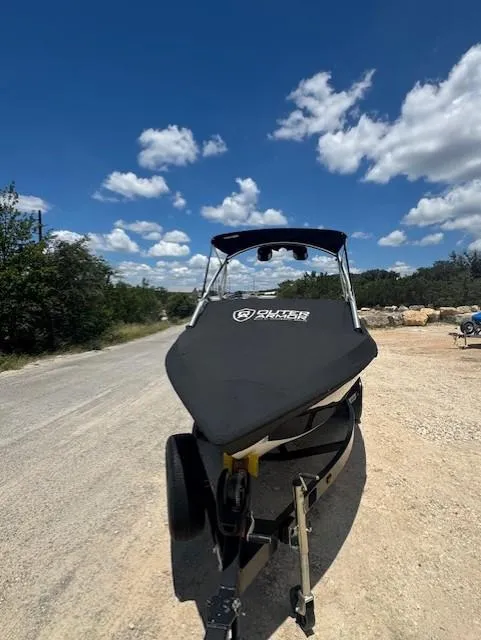 Slide: The Image of 2008 Tigé Z1 boat on trailer under blue sky with clouds. - 10