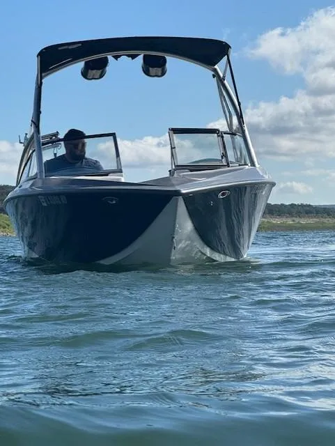 Slide: The Image of 2008 Tigé Z1 boat on water under clear sky. - 7