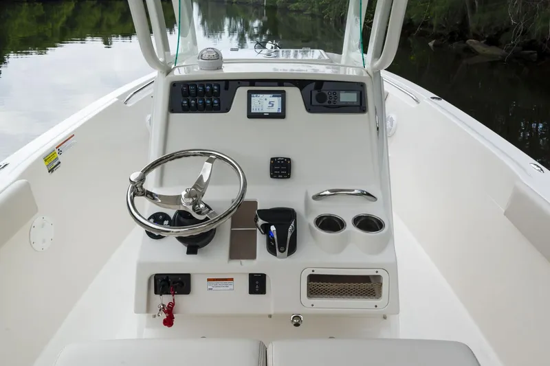 Slide: The Image of 2024 Sailfish 241 CC boat stern with motor and water view. - 6