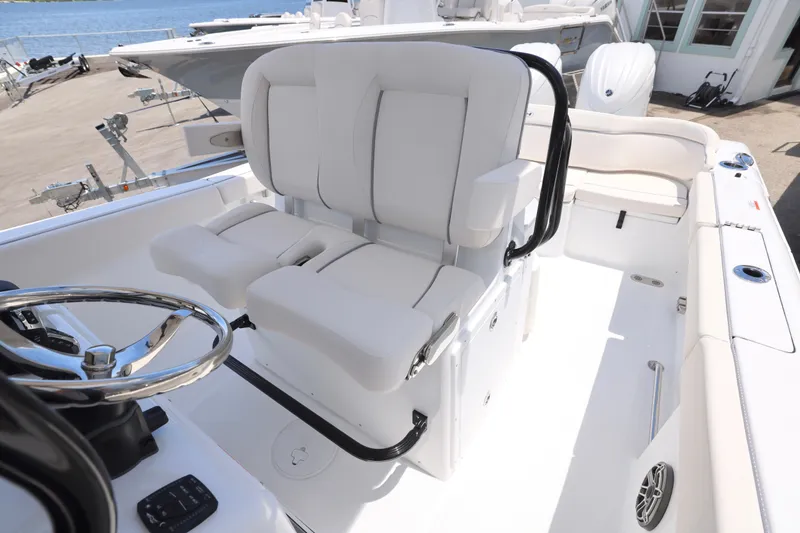 Slide: The Image of Interior of 2026 Sea Hunt Ultra 265 SE boat with Yamaha engine, featuring seating and storage. - 14