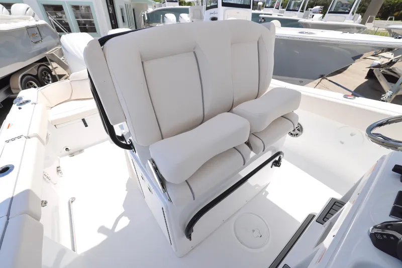 Slide: The Image of 2026 Sea Hunt Ultra 265 SE boat anchor compartment with open hatch on deck. - 17