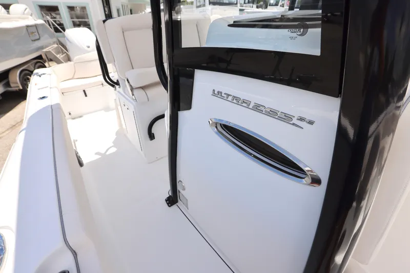 Slide: The Image of 2026 Sea Hunt Ultra 265 SE boat console with Garmin electronics and sleek design. - 20