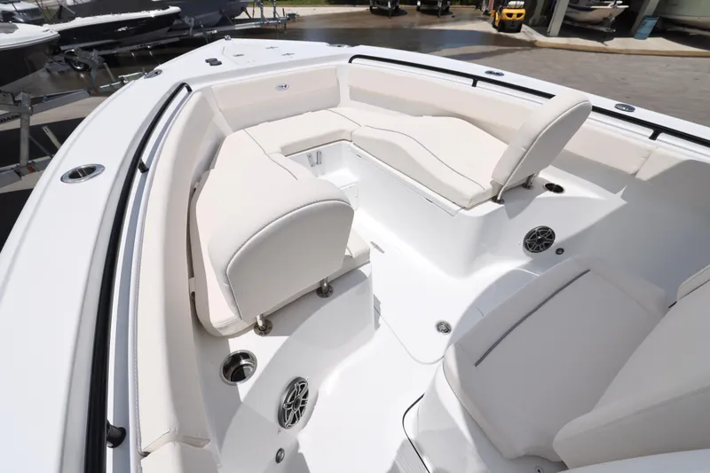 Slide: The Image of 2025 Sea Hunt Ultra 265 SE boat cruising on calm waters. - 22