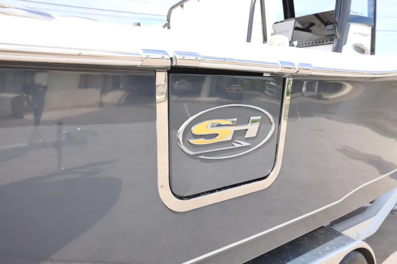 Slide: The Image of Family enjoying a day on a 2025 Sea Hunt Ultra 265 SE boat. - 23