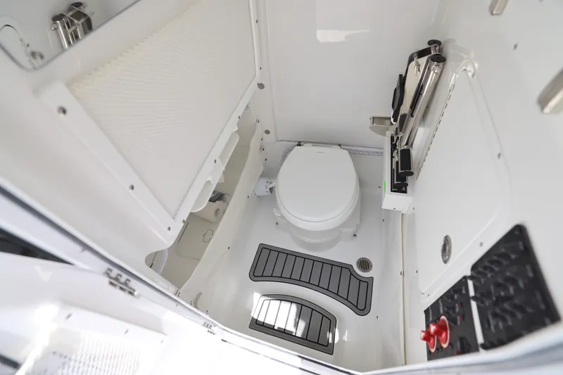 Slide: The Image of 2026 Sea Hunt Ultra 265 SE boat console with Garmin display and steering wheel. - 9