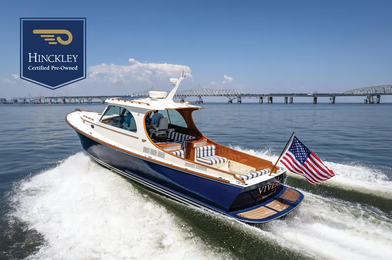 The Image of Hinckley Picnic Boat 37 MKIII, 2015, cruising on water with American flag, certified pre-owned. - 0