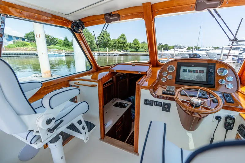 Slide: The Image of Interior of 2015 Hinckley Picnic Boat 37 MKIII with helm, controls, and seating. - 23