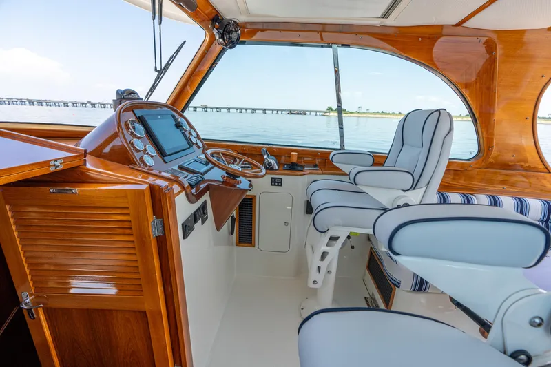 Slide: The Image of Interior of 2015 Hinckley Picnic Boat 37 MKIII with elegant helm and seating. - 25