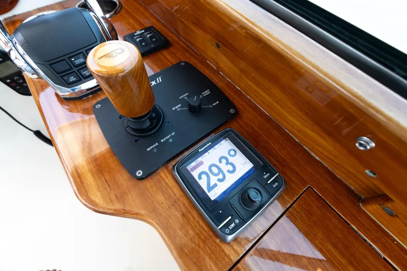 Slide: The Image of Hinckley Picnic Boat 37 MKIII 2015 helm with wooden throttle and digital compass display. - 29