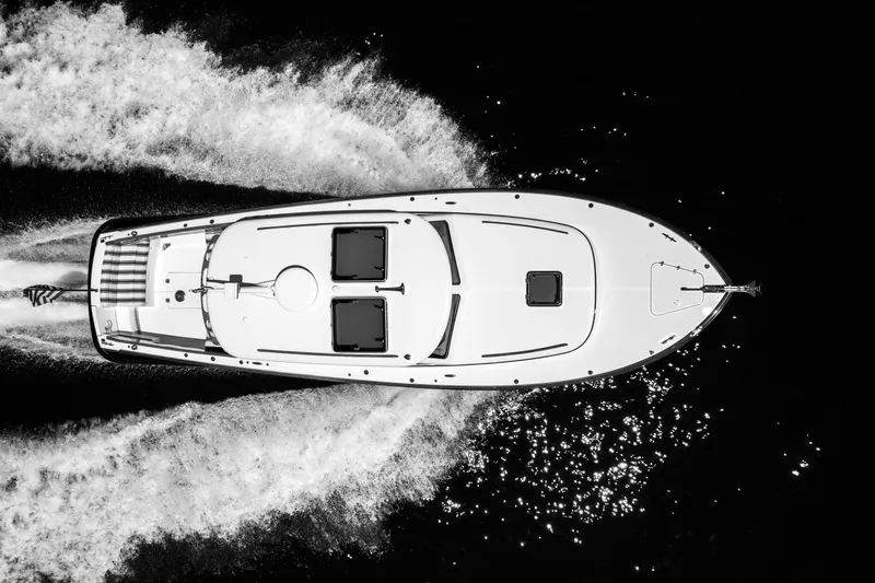 Slide: The Image of Top view of 2015 Hinckley Picnic Boat 37 MKIII cruising on water. - 42