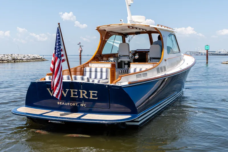 Slide: The Image of 2015 Hinckley Picnic Boat 37 MKIII on water, American flag, Beaufort, NC. - 5