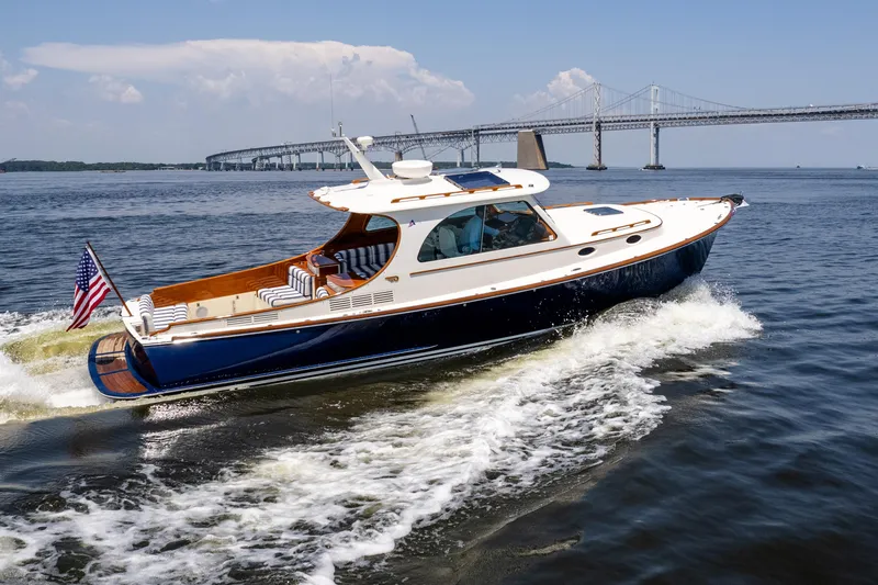 Slide: The Image of 2015 Hinckley Picnic Boat 37 MKIII cruising near a bridge on a sunny day. - 7