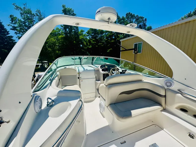 Slide: The Image of Interior of a 2005 Chaparral Signature 270 boat under sunny weather. - 11