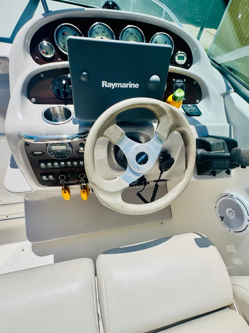 Slide: The Image of 2005 Chaparral Signature 270 helm with Raymarine navigation system. - 16