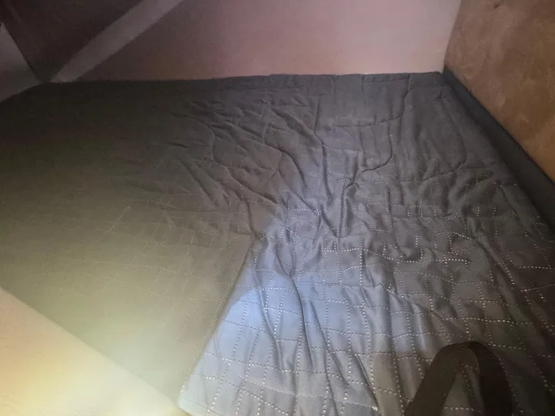 Slide: The Image of Interior of 2005 Chaparral Signature 270 boat with gray bedding. - 17