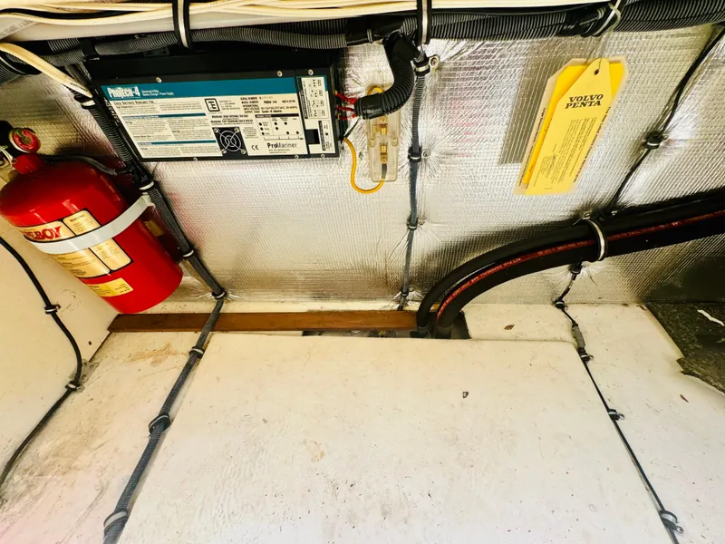 Slide: The Image of Interior of 2005 Chaparral Signature 270 boat with fire extinguisher and wiring. - 33