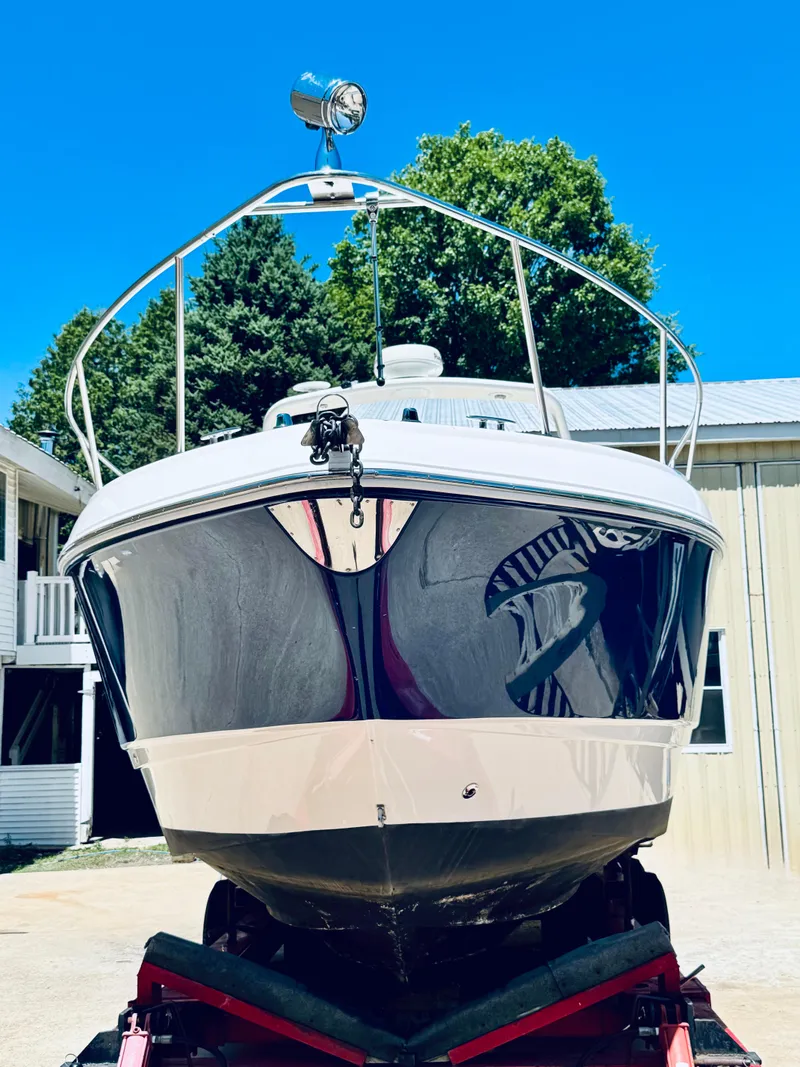 Slide: The Image of 2005 Chaparral Signature 270 boat on trailer, blue sky. - 35