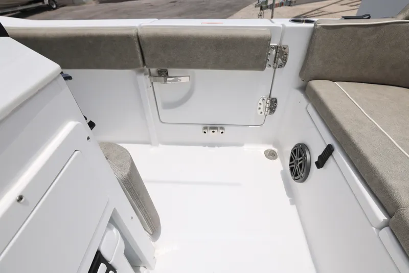 Slide: The Image of 2026 Sea Hunt Ultra 245 SE boat interior with cushioned seating and modern design. - 11