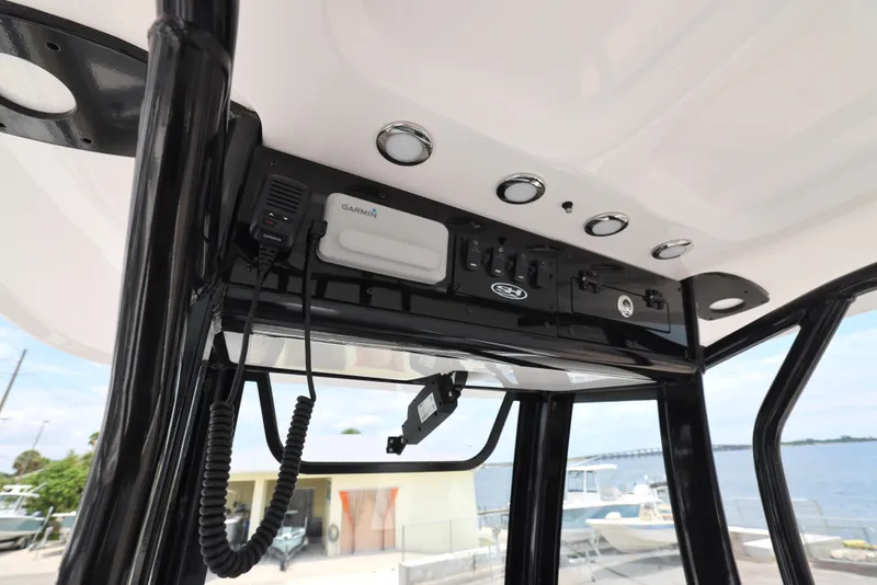 Slide: The Image of 2026 Sea Hunt Ultra 245 SE boat interior with cushioned seating and sleek design. - 14