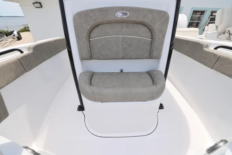 Slide: The Image of 2026 Sea Hunt Ultra 245 SE boat with Yamaha outboard motor, docked by the water. - 15