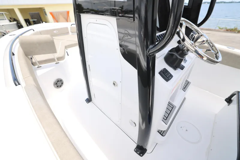 Slide: The Image of T-top of 2026 Sea Hunt Ultra 245 SE boat with rod holders and speakers. - 16