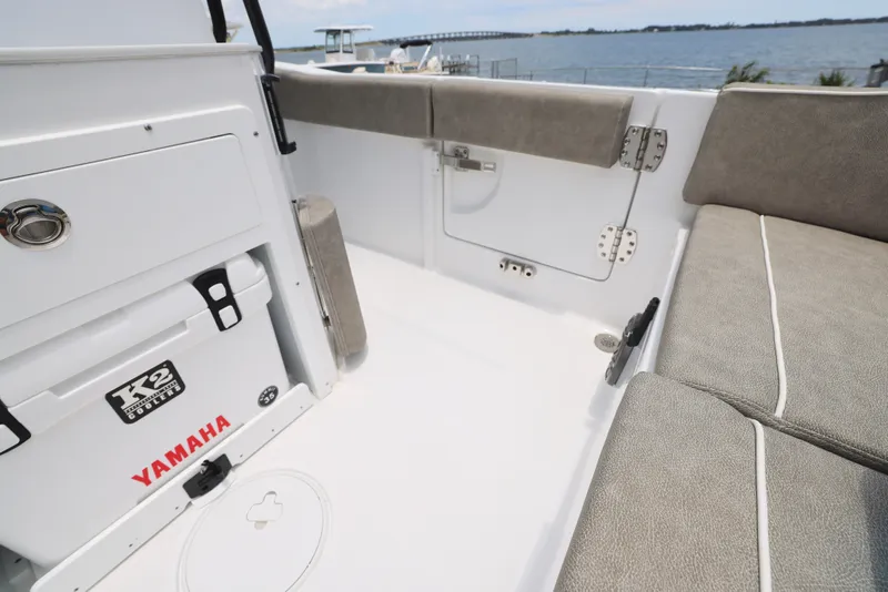Slide: The Image of 2026 Sea Hunt Ultra 245 SE boat console with Garmin display and steering wheel. - 20