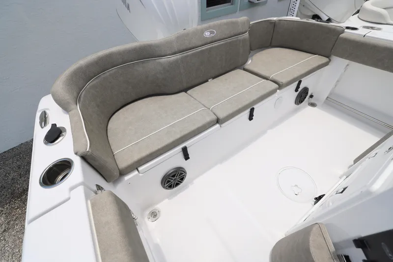 Slide: The Image of 2026 Sea Hunt Ultra 245 SE boat with cushioned seating and sleek design. - 21