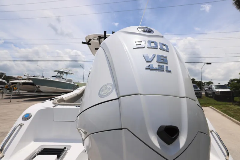 Slide: The Image of 2026 Sea Hunt Ultra 245 SE boat console with Garmin display and steering wheel. - 25