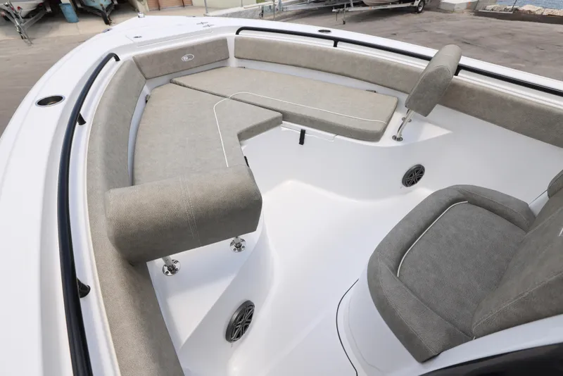 Slide: The Image of 2026 Sea Hunt Ultra 245 SE boat interior with compact marine toilet. - 5