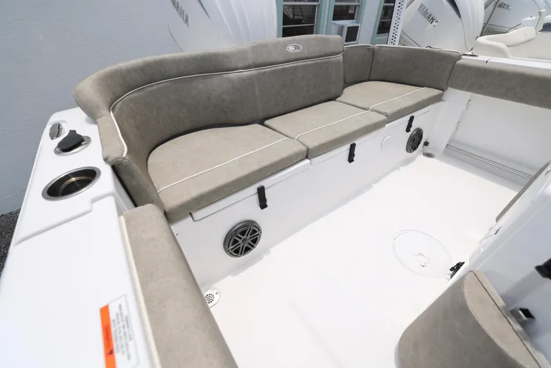 Slide: The Image of 2026 Sea Hunt Ultra 245 SE boat interior with cushioned seating and modern design. - 6
