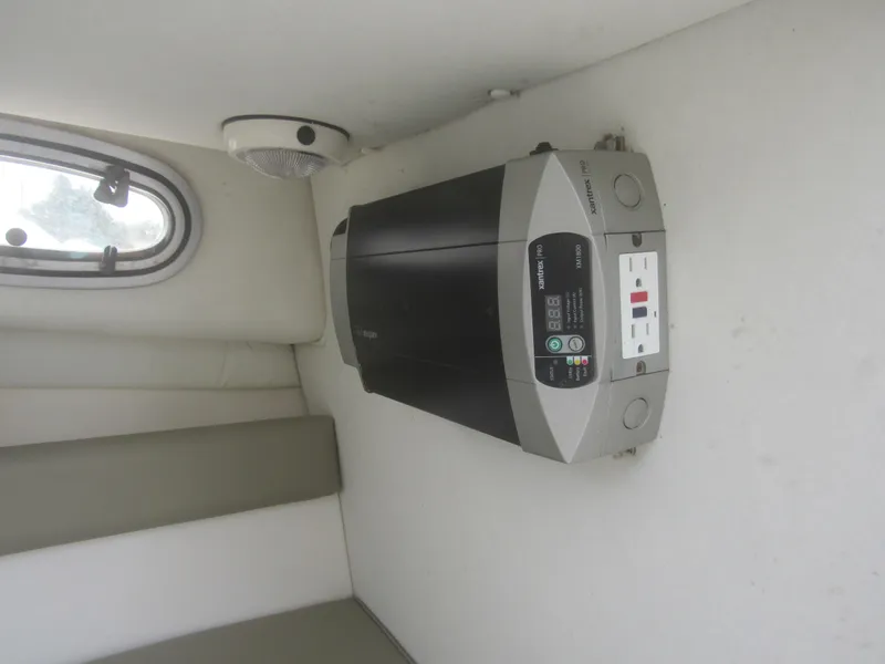 Slide: The Image of Inverter installed inside a 1997 Boston Whaler 23 Conquest boat cabin. - 7