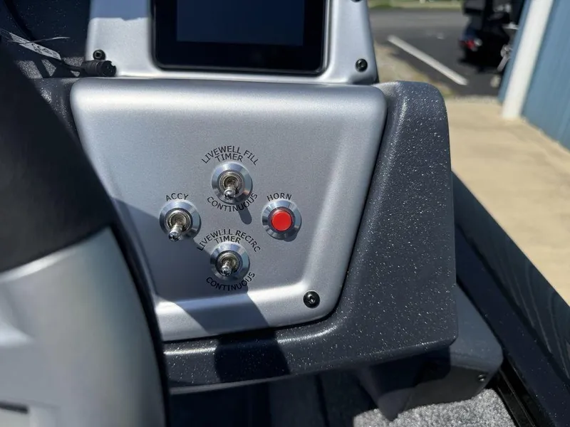 Slide: The Image of Control panel of 2025 Tracker Pro Team 190 boat with switches and horn button. - 16