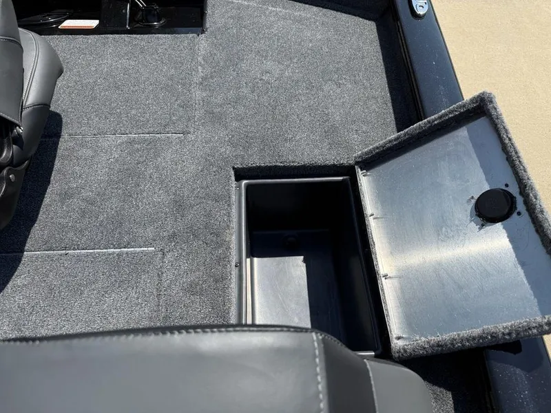 Slide: The Image of 2025 Tracker Pro Team 190 boat interior with open storage compartment. - 21