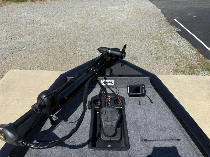 Slide: The Image of 2025 Tracker Pro Team 190 boat deck with trolling motor and fish finder. - 6