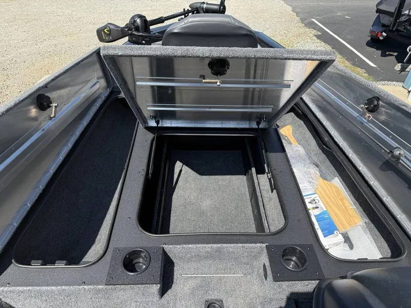 Slide: The Image of Open storage compartment in 2025 Tracker Pro Team 190 boat, showcasing interior space and features. - 8