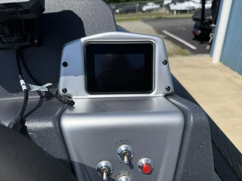 Slide: The Image of Control panel of 2025 Tracker Pro Team 190 boat with screen and switches. - 9
